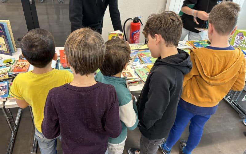 children's reading marathon in front of the book stand
