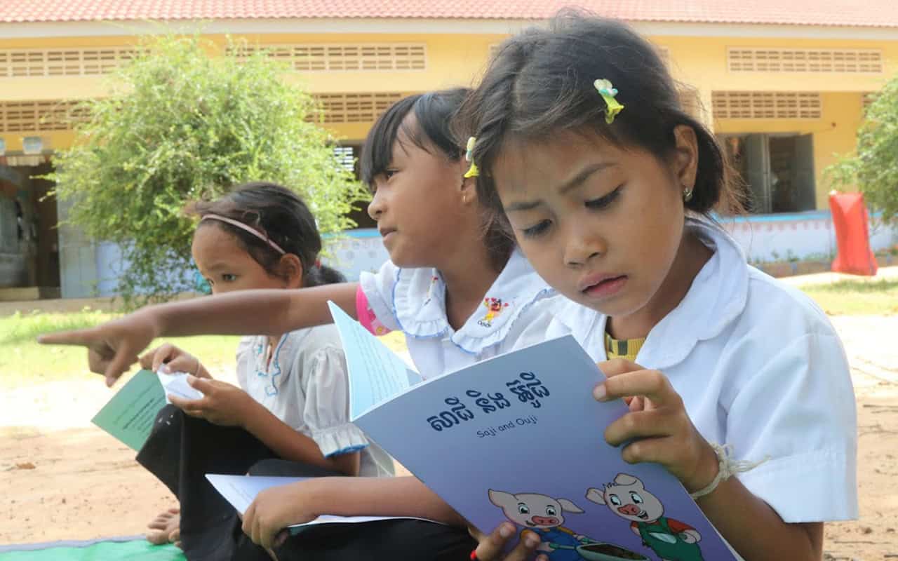 Cambodia: a reading session for a young girl